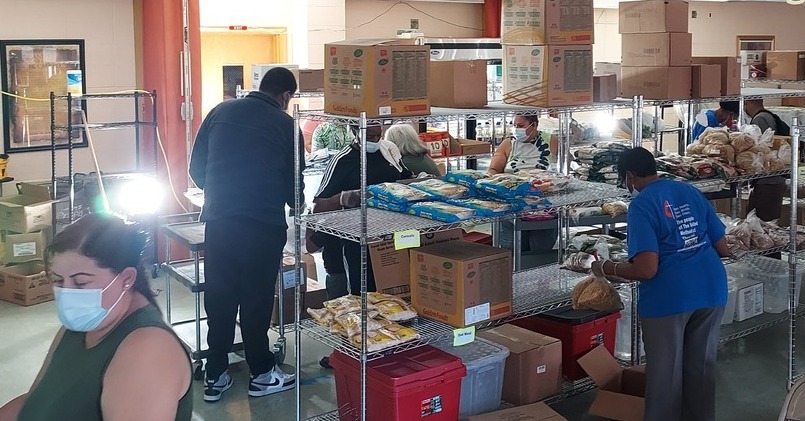 Food Pantry Open With Flood Lights And Volunteers