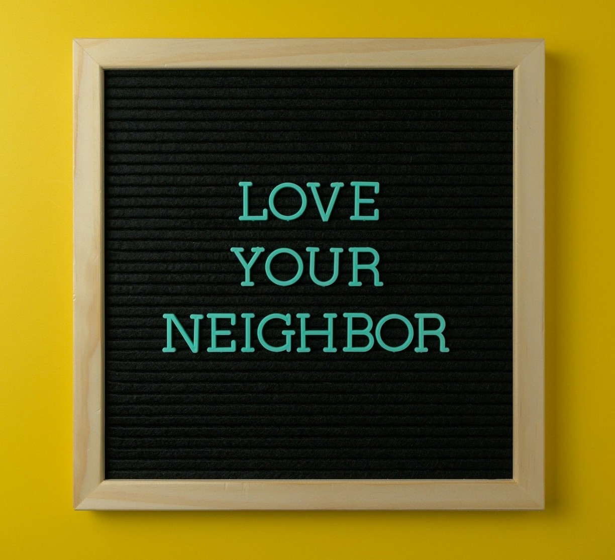 Loveyourneighborsigninstory